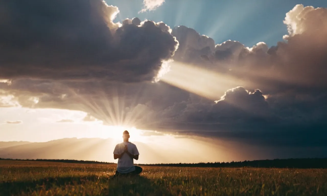 The photo captures a serene sunset, illuminating a person kneeling in prayer with rays of light filtering through the clouds, symbolizing God's silent yet powerful communication with us.