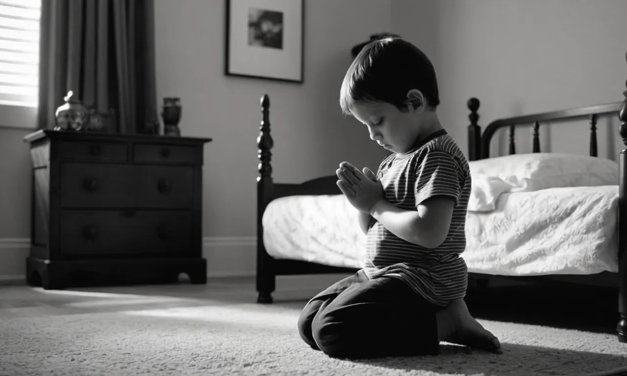 A black and white image captures a young child kneeling beside their bed, hands clasped tightly in prayer, seeking guidance and enlightenment from a higher power.